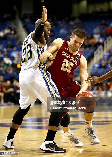 Joe Rahon of the Boston College Eagles runs into Trae Golden of the Georgia Tech Yellow Jackets during the first round of the 2014 Men's ACC...