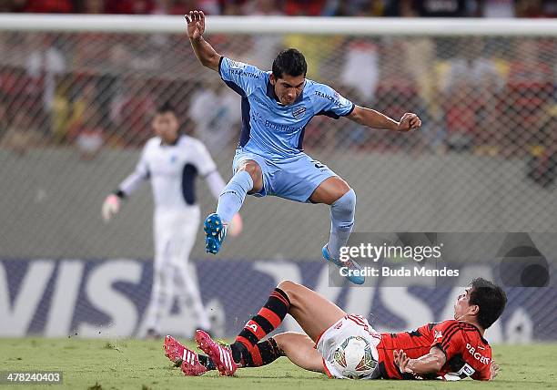 Victor Caceres of Flamengo battles for the ball against Walter Flores of Bolivar during a match between Flamengo and Bolivar as part of Copa...