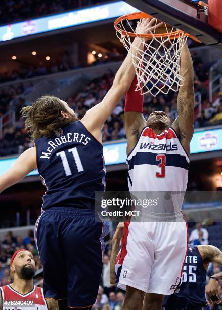 Charlotte Bobcats forward Josh McRoberts blocks the shot of Washington Wizards guard Bradley Beal during the second half of their game played at the...