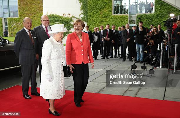 German Chancellor Angela Merkel greets Queen Elizabeth II as Prince Philip, Duke of Edinburgh and Chief of Staff of the German Chancellery Peter...