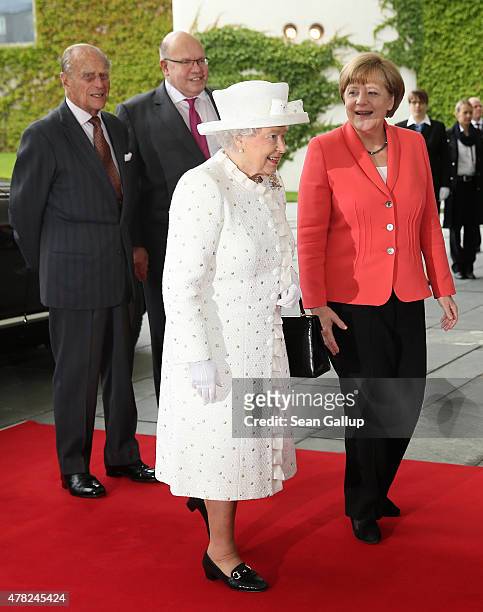 German Chancellor Angela Merkel greets Queen Elizabeth II as Prince Philip, Duke of Edinburgh and Chief of Staff of the German Chancellery Peter...