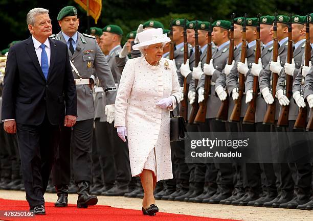 Britain's Queen Elizabeth II and German President Joachim Gauck inspect the military honor guard during a welcoming ceremony at Bellevue Palace in...