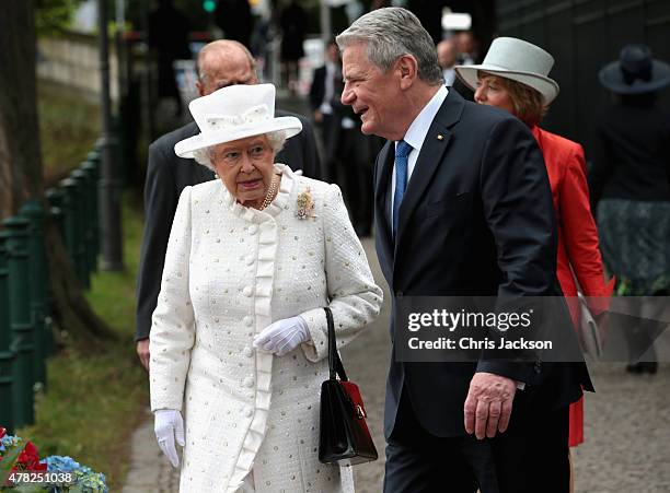 Queen Elizabeth II and Prince Philip, Duke of Edinburgh walk to the bank of the River Spree to travel by boat to the Chancellery with Germany...