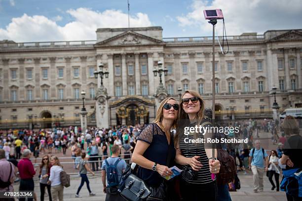 Tourists take a selfie in front of Buckingham Palace on June 24, 2015 in London, England. The Queen may have to move out of Buckingham Palace, her...