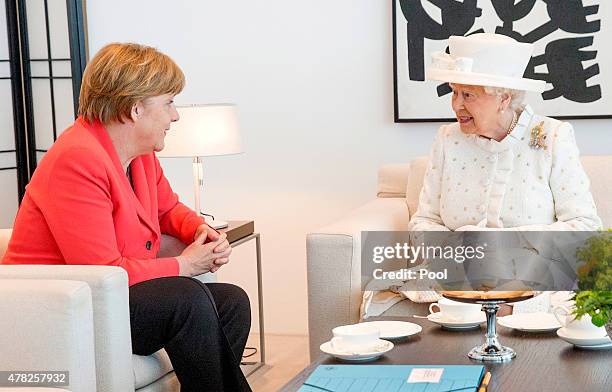 German Chancellor Angela Merkel and Queen Elizabeth II speak during their meeting at the Federal Chancellery on the second of the royal couple's...