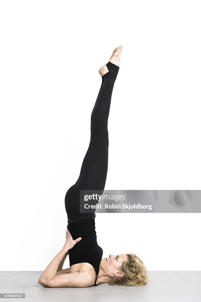 Woman on floor doing yoga excercises