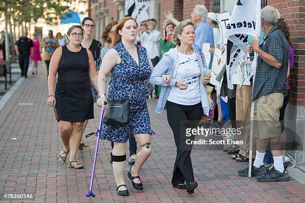 Boston Marathon Bombing victim Erika Brannock, front left, arrives with her mother, Carol Downing at John Joseph Moakley United States Courthouse for...