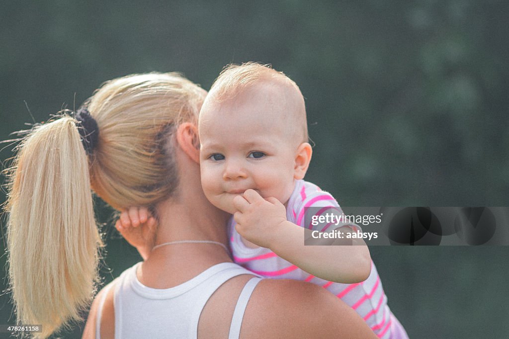 Mother and child together in the park leisure time