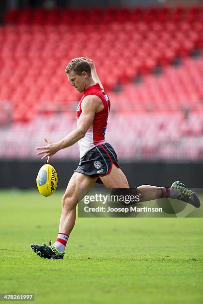Ryan O'Keefe of the Swans kicks the ball during Sydney Swans training session ahead of the round one AFL match between the Greater Western Sydney...