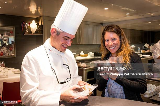 Base jumper and wing suit pioneer Geraldine Fasnacht is photographed for Paris Match with chef Benoit Violier who prepares her specials cakes for her...