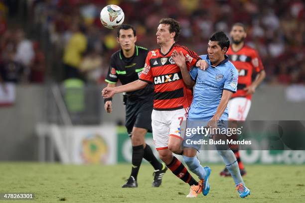 Elano of Flamengo battles for the ball against Damir Miranda of Bolivar during a match between Flamengo and Bolivar as part of Copa Bridgestone...