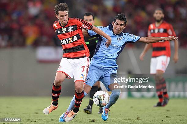 Elano of Flamengo battles for the ball against Damir Miranda of Bolivar during a match between Flamengo and Bolivar as part of Copa Bridgestone...
