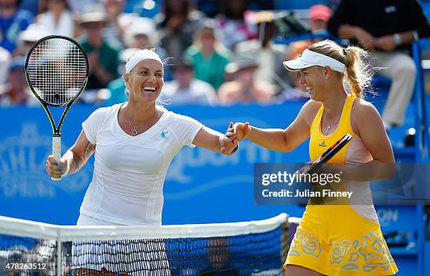 Svetlana Kuznetsova of Russia shares a joke at net with Caroline Wozniacki of Denmark during the Aegon International day four at Devonshire Park on...