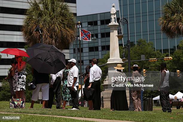 People wait in line to pay their respects before the coffin of church pastor and South Carolina State Sen. Clementa Pinckney arrives to lie in the...