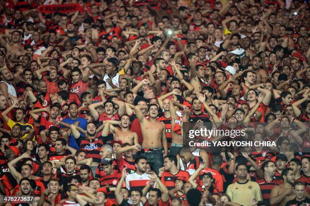 Supporters of Brazil's Flamengo cheer for their team before their 2014 Copa Libertadores football match against Bolivia's Bolivar at Mario Filho...