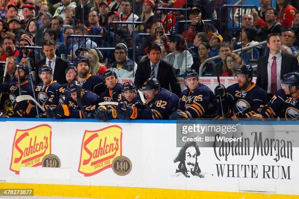Assistant coach Teppo Numminen , interim head coach Ted Nolan and assistant coach Joe Sacco of the Buffalo Sabres watch the action against the...