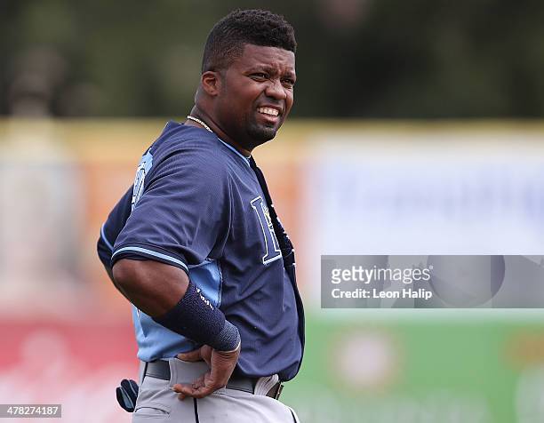 Wilson Betemit of the Tampa Bay Rays looks into the dugout during the game against the Toronto Blue Jays at Florida Auto Exchange Stadium on March...
