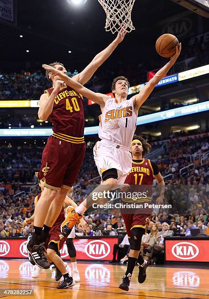 Goran Dragic of the Phoenix Suns lays up a shot past Tyler Zeller and Anderson Varejao of the Cleveland Cavaliers during the second half of the NBA...