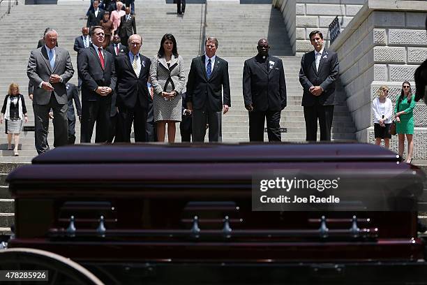 South Carolina Governor Nikki Haley looks on at the coffin while standing with other lawmakers as South Carolina Highway Patrol Honor Guard prepare...