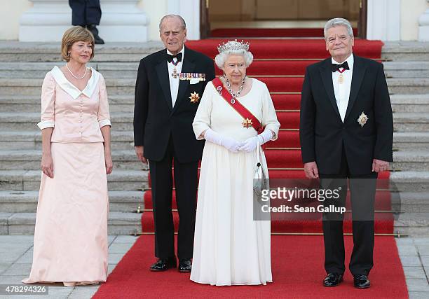 German President Joachim Gauck and his partner Daniela Schadt greet Queen Elizabeth II and Prince Philip, the Duke of Edinburgh, at Schloss Bellevue...