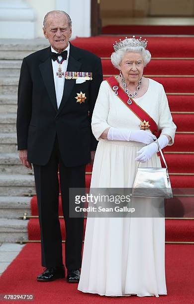 Queen Elizabeth II and Prince Philip, the Duke of Edinburgh, arrive for the state banquet in their honour at Schloss Bellevue palace on the second of...