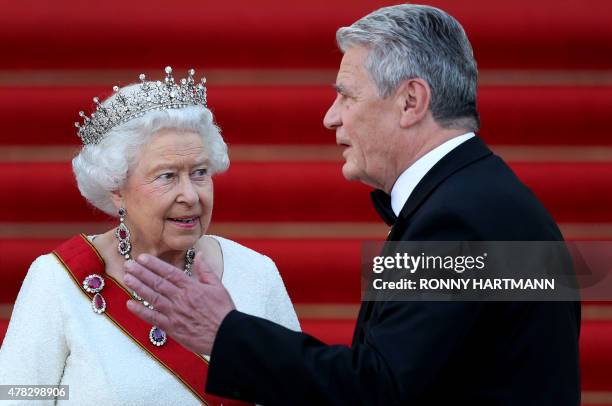 Britain's Queen Elizabeth II is welcomed by German President Joachim Gauck as she arrives for a receiving line and state banquet at the presidential...