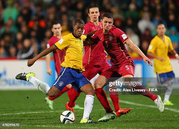 Alef of Brazil shoots past Milos Veljkovic of Serbia during the FIFA U-20 World Cup Final match between Brazil and Serbia at North Harbour Stadium on...