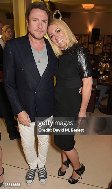 Simon Le Bon and Grainne Stevenson attend the Quercus Foundation Pre-Wimbledon Cocktails with Ana Ivanovic in the Ten Room at Hotel Cafe Royal on...