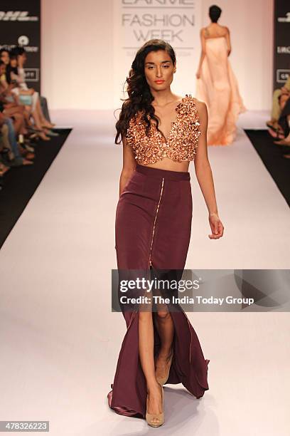 Model walks the ramp for designer Nikhil Thampi during the Lakme Fashion Week 2014 in Mumbai.