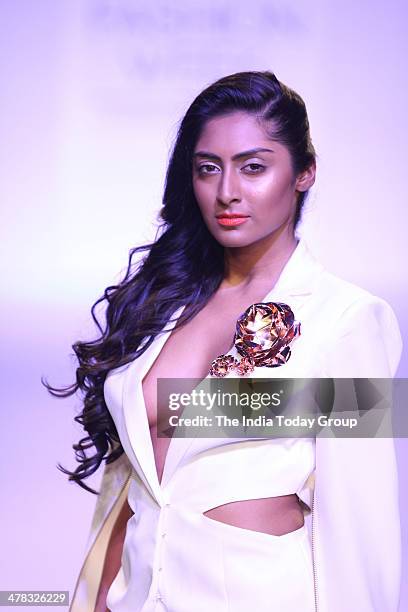 Model walks the ramp for designer Nikhil Thampi during the Lakme Fashion Week 2014 in Mumbai.