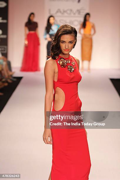 Model walks the ramp for designer Nikhil Thampi during the Lakme Fashion Week 2014 in Mumbai.