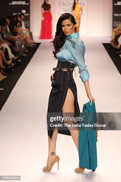 Model walks the ramp for designer Nikhil Thampi during the Lakme Fashion Week 2014 in Mumbai.