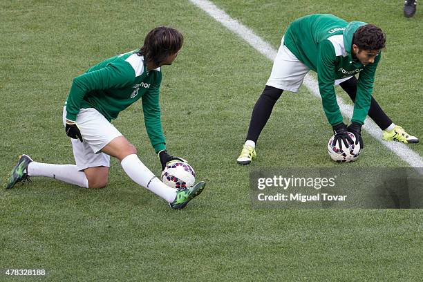 Marcelo Moreno and Sebastian Gamarra of Bolivia stretch at the end of a training session at German Becker Stadium on June 20, 2015 in Temuco, Chile....