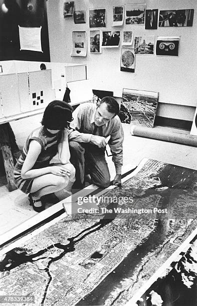 Charles Eames and an assistant, Barbara Charles, work on a Smithsonian Institution exhibit about photography and the city.