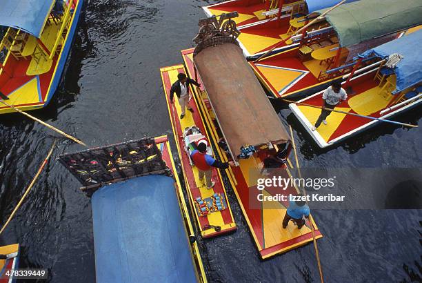 brightly painted trajineras in xochimilco - trajinera stock pictures, royalty-free photos & images