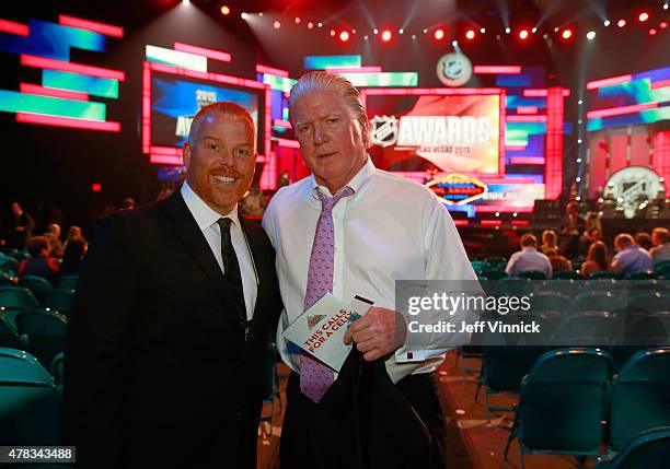 Calgary Flames President of Hockey Operations Brian Burke and Calgary Flames PR Sean Kelso look on before the 2015 NHL Awards at MGM Grand Garden...