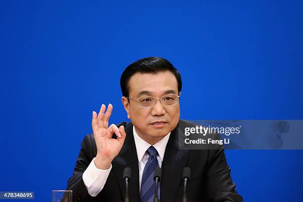 China's Premier Li Keqiang speaks during a press conference after the closing session of the National People's Congress at the Great Hall of the...