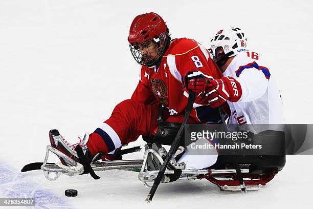Dmitrii Lisov of Russia clashes with Knut Andre Nordstoga of Norway during the Ice Sledge Hockey semifinal match between Russia and Norway at the...