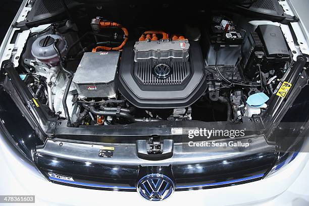 An open hood reveals the motor of a Volkswagen e-Golf electric car prior to the company's annual press conference to announce financial results for...