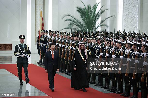 Chinese Vice President Li Yuanchao invites Saudi Crown Prince Salman bin Abdulaziz to view an honour guard during a welcoming ceremony inside the...