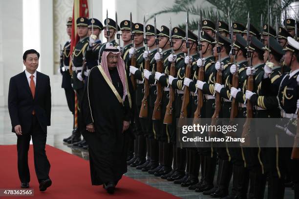 Chinese Vice President Li Yuanchao invites Saudi Crown Prince Salman bin Abdulaziz to view an honour guard during a welcoming ceremony inside the...