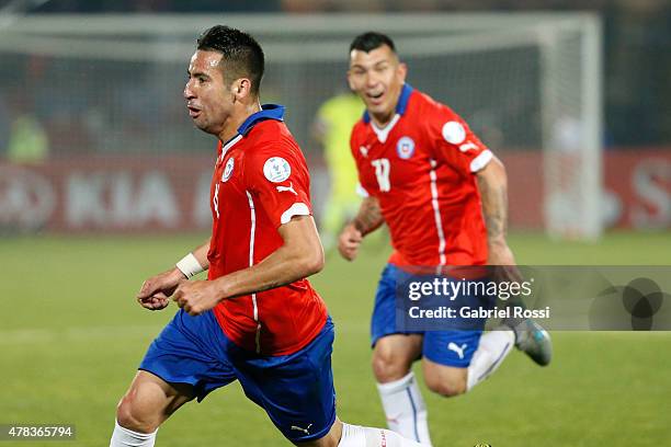 Mauricio Isla of Chile celebrates after scoring the opening goal during the 2015 Copa America Chile quarter final match between Chile and Uruguay at...