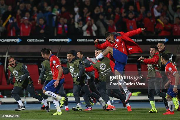 Mauricio Isla of Chile celebrates after scoring the opening goal during the 2015 Copa America Chile quarter final match between Chile and Uruguay at...