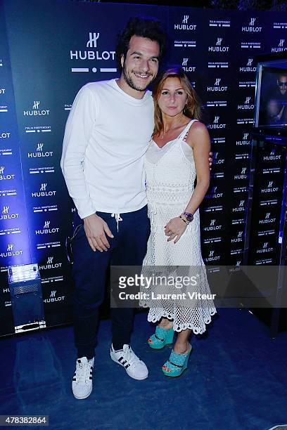 Singer Amir and Hairdresser Sarah Guetta attend the Hublot Blue Coktail at Mr Bleu at Palais de Tokyo on June 24, 2015 in Paris, France.