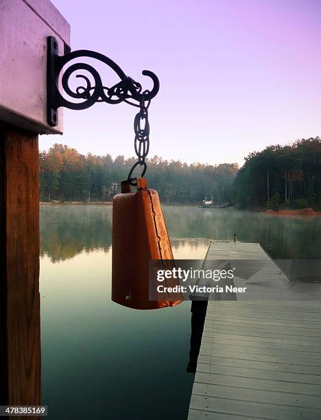 cow bell on foggy lake - cowbell stock pictures, royalty-free photos & images
