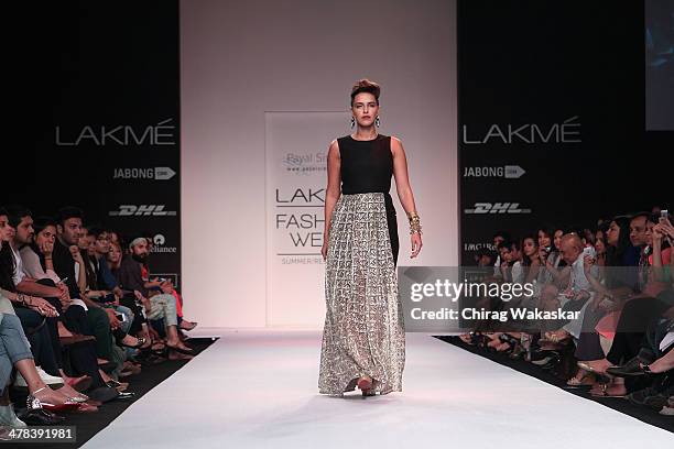 Neha Dhupia walks the runway wearing designs by Payal Singhal at day 3 of Lakme Fashion Week Summer/Resort 2014 at the Grand Hyatt on March 13, 2014...