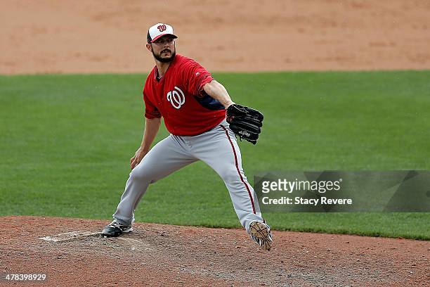 Clay Hensley of the Washington Nationals throws a pitch against the Atlanta Braves in the sixth inning of a game at Champion Stadium on March 12,...