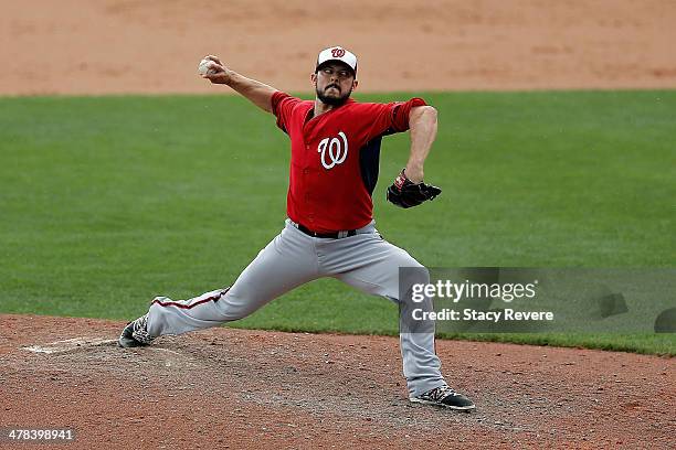 Clay Hensley of the Washington Nationals throws a pitch against the Atlanta Braves in the sixth inning of a game at Champion Stadium on March 12,...