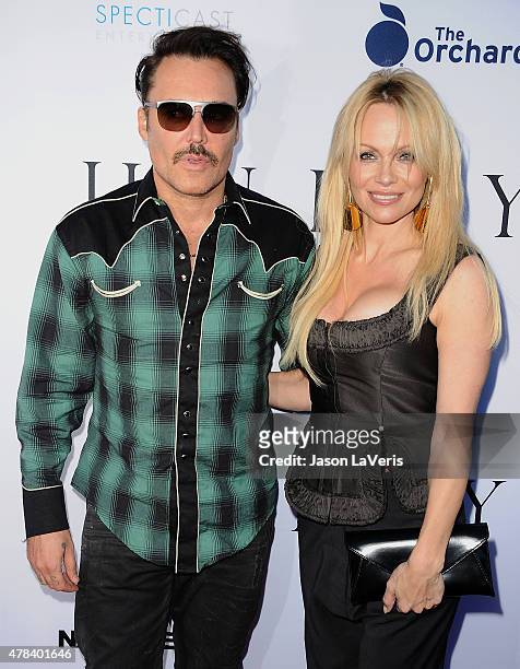 David LaChapelle and Pamela Anderson attend the world premiere screening of "Unity" at DGA Theater on June 24, 2015 in Los Angeles, California.