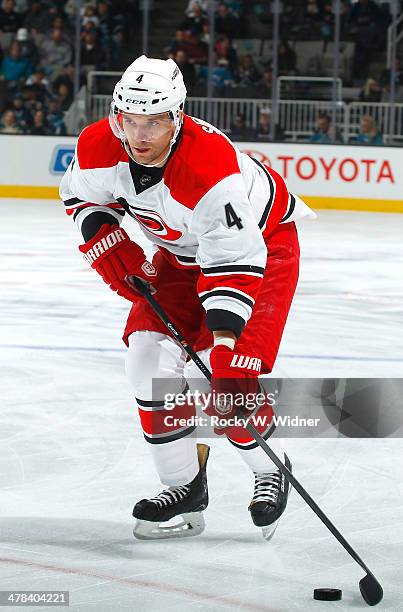 Andrej Sekera of the Carolina Hurricanes skates with the puck against the San Jose Sharks at SAP Center on March 4, 2014 in San Jose, California.